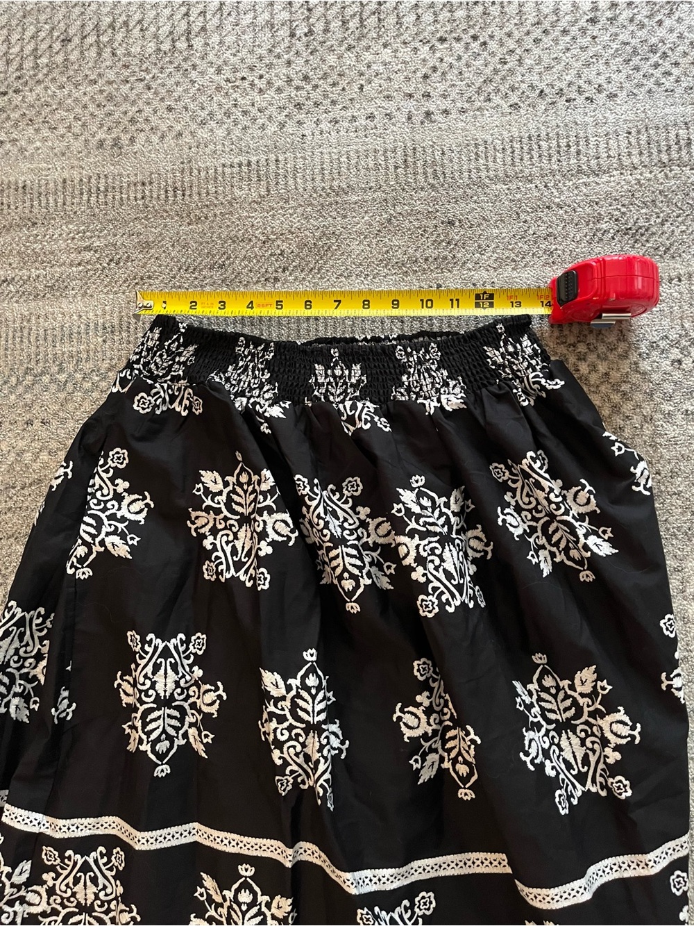 CeCe cotton poplin A-line midi skirt in black with a white botanical print. - Picture 6 of 7